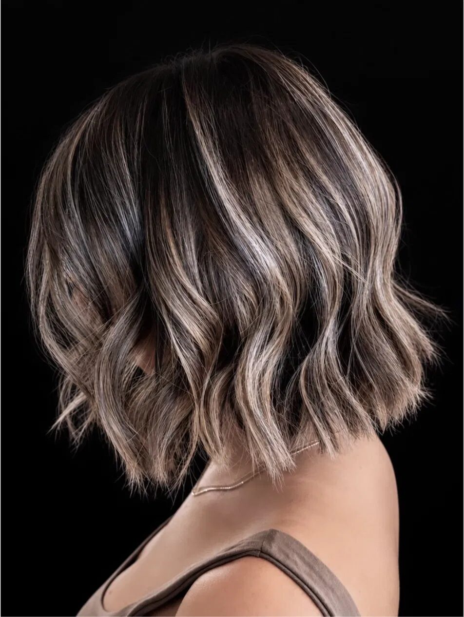 Long bright blonde beachy waves, styled in the salon